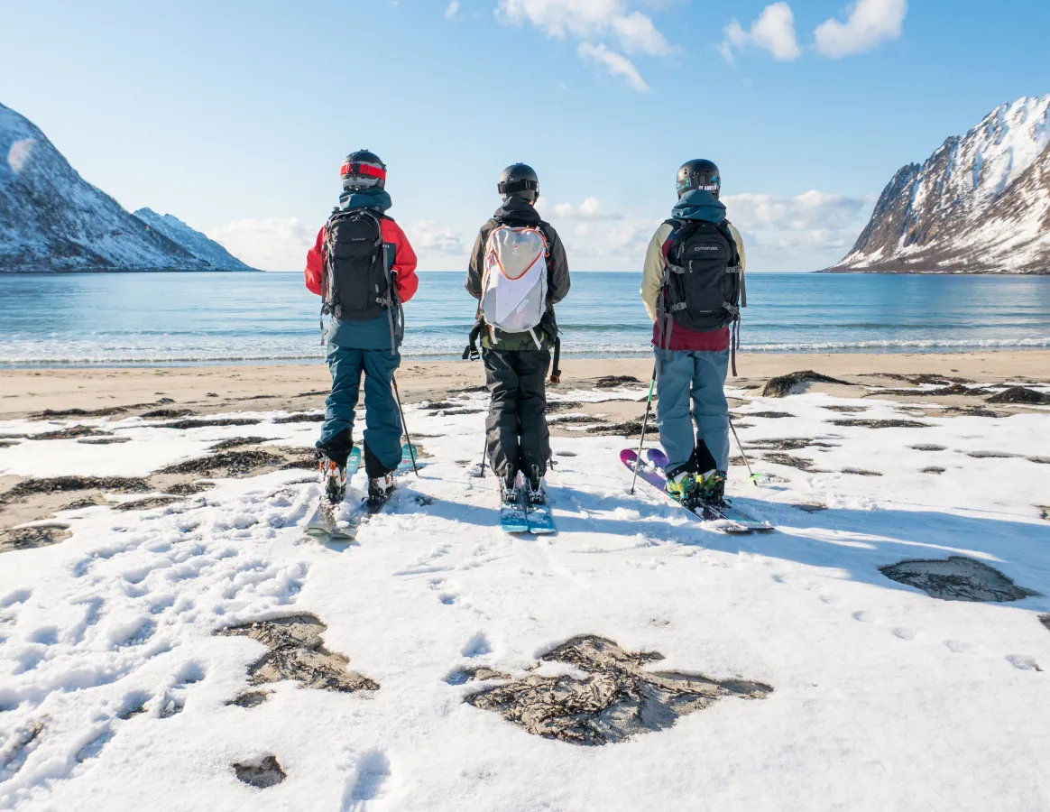 Senja skiers on beach Pete Oswald